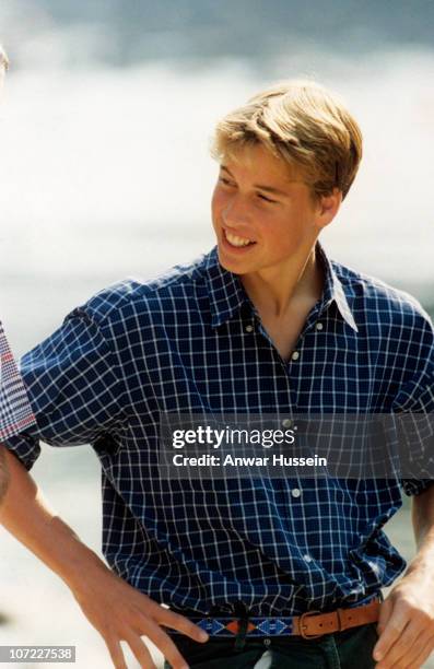 Prince William relaxes on the banks of the River Dee just a month before his mother's death, August 12, 1997 in Balmoral, Scotland.