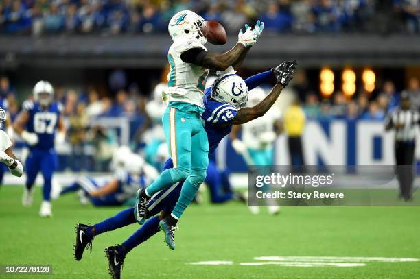 Reshad Jones of the Miami Dolphins breaks up a pass intended for Dontrelle Inman of the Indianapolis Colts in the second quarter at Lucas Oil Stadium...