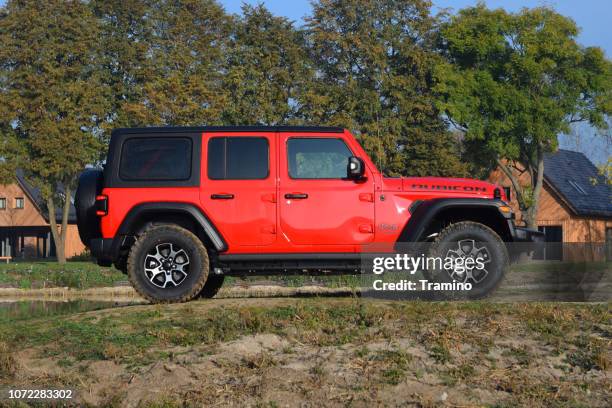 jeep wrangler rubicon on the road - jeep stock pictures, royalty-free photos & images