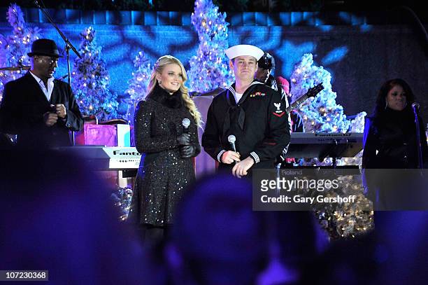 Jessica Simpson and Petty Officer John Britt perform live at the Rockefeller Center Annual Christmas Tree Lighting at Rockefeller Center on November...