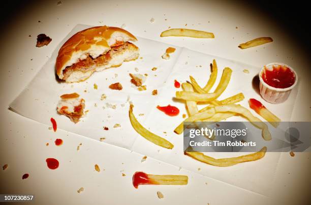 half eaten burger and fries. - french fries and ketchup stock pictures, royalty-free photos & images