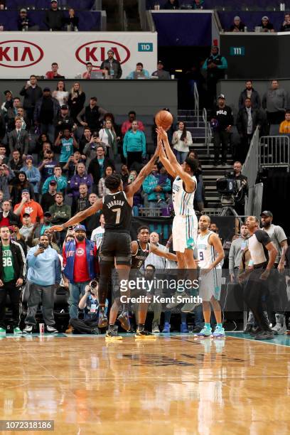 Jeremy Lamb of the Charlotte Hornets shoots the game winning shot against the Detroit Pistons on December 12, 2018 at Spectrum Center in Charlotte,...