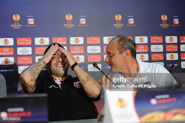 Fabrizio Miccoli captain of Palermo smiles as coach Delio Rossi looks on during the press conference ahead of the UEFA Europa League Group F match...