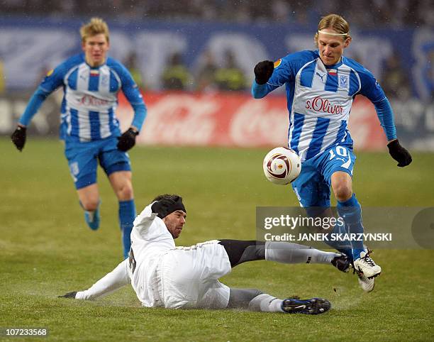 Sergei Krivets of Lech Poznan fights for the ball with Vincenzo Camilleri of Juventus during their UEFA Europa League football match on December 1,...