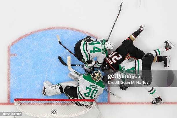 Miro Heiskanen, Gavin Bayreuther and Ben Bishop of the Dallas Stars defend against Pontus Aberg of the Anaheim Ducks during the third period of a...