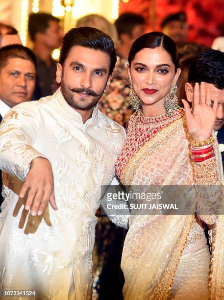 Indian Bollywood actors Ranveer Singh and Deepika Padukone attend the wedding of Indian businesswoman Isha Ambani with Indian businessman Anand...