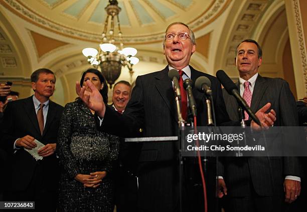 Senate Minority Leader Mitch McConnell and House Minority Leader John Boehner talk with reporters after meeting with Republican governors-elect, at...