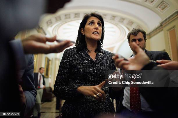 South Carolina Governor-elect Kikki Haley talks to reporters after meeting with House Minority Leader John Boehner and Senate Minority Leader Mitch...