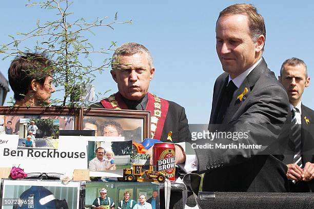 Prime Minister John Key lays a fern on a table at a national memorial service for the 29 miners that lost their lives in the Pike River Mine at Omoto...