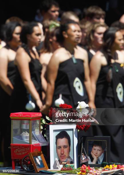 Late miner's personal items and photos are displayed as the Maori Kapa haka group perform at a national memorial service for the 29 miners that lost...