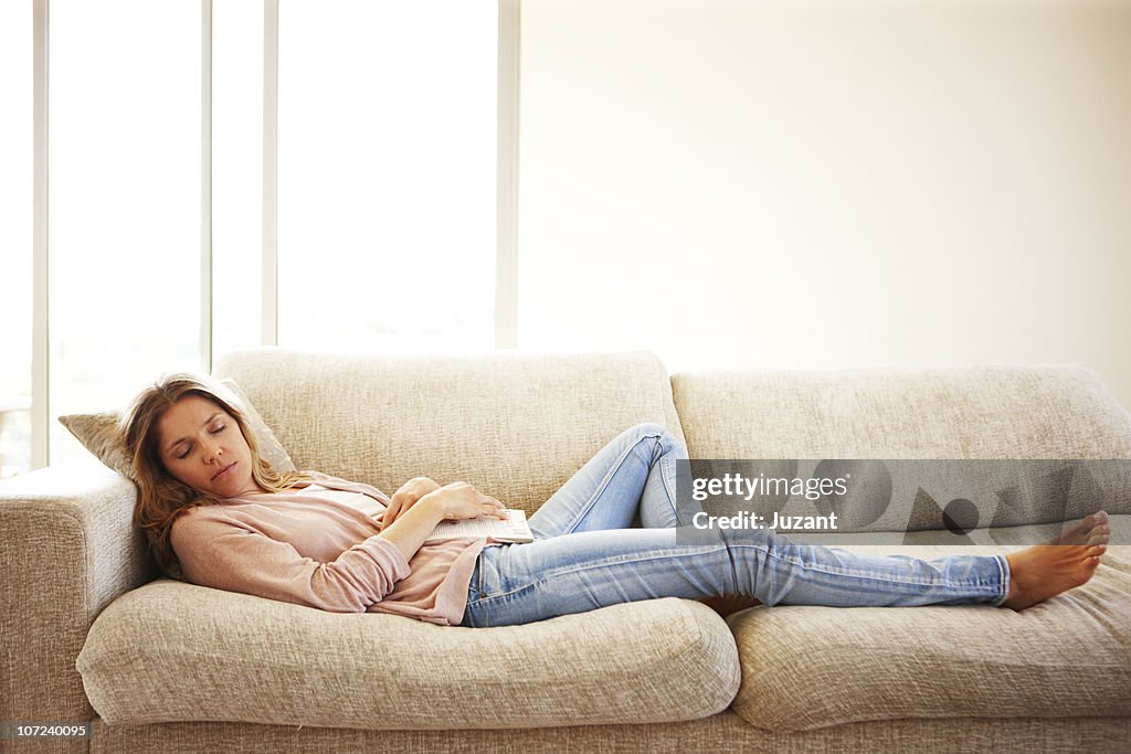 Woman sleeping on sofa