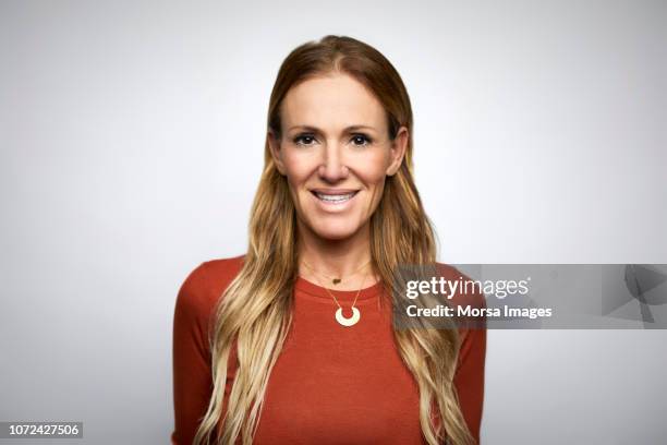 businesswoman smiling against white background - business casual white background stock pictures, royalty-free photos & images