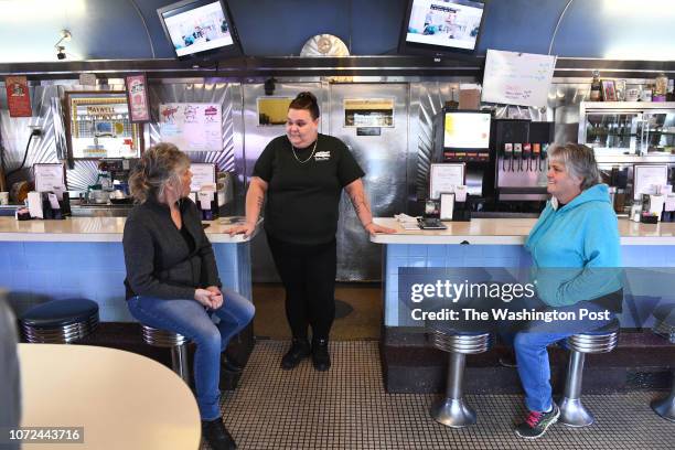 Mother and daughter Melissa McDonald, left, and Emily Buckley, center, chat along with Donna Rock during a lull at the Tastee Diner at a shift change...