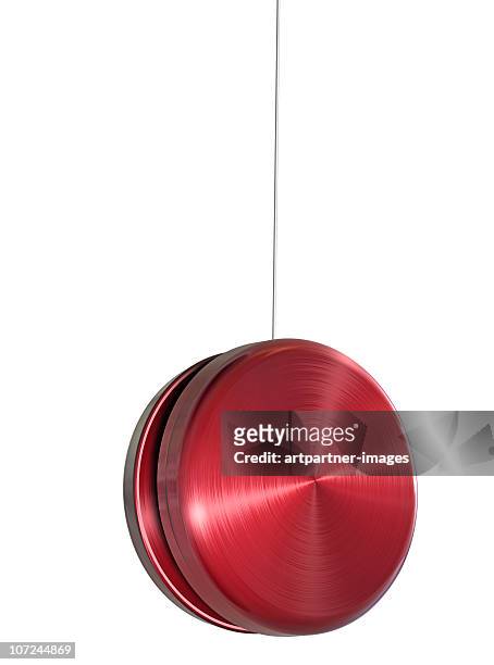 red yo-yo on white background - yo yo stock pictures, royalty-free photos & images
