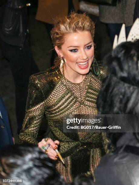 Amber Heard is seen arriving at the premiere of Warner Bros. Pictures' 'Aquaman' at the Chinese Theatre on December 12, 2018 in Los Angeles,...