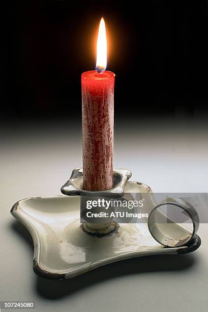 candle in holder - candle flame stockfoto's en -beelden