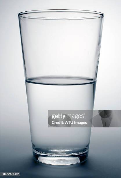 glass water half full - half ストックフォトと画像