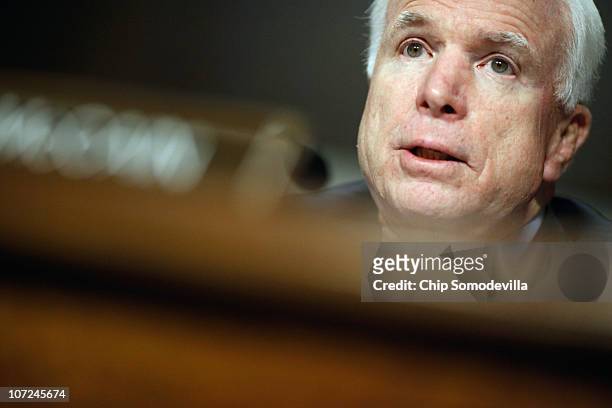 Senate Armed Services Committee ranking member Sen. John McCain delivers opening remarks during a hearing about the military's "don't ask, don't...