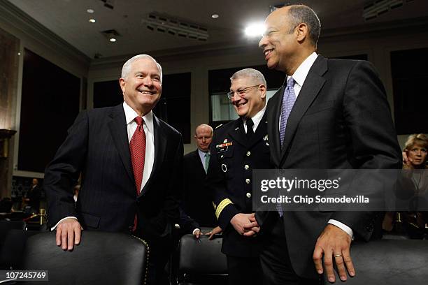 Defense Secretary Robert Gates talks with co-chairmen of the Defense Department Comprehensive Review Working Group U.S. Army Europe commander Gen....