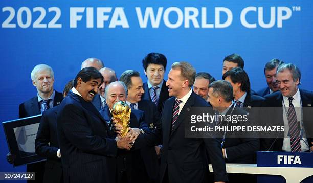 Emir of the State of Qatar Sheikh Hamad bin Khalifa Al-Thani , Fifa President Joseph Blatter and Russia's Deputy Prime Minister Igor Shuvalov pose...