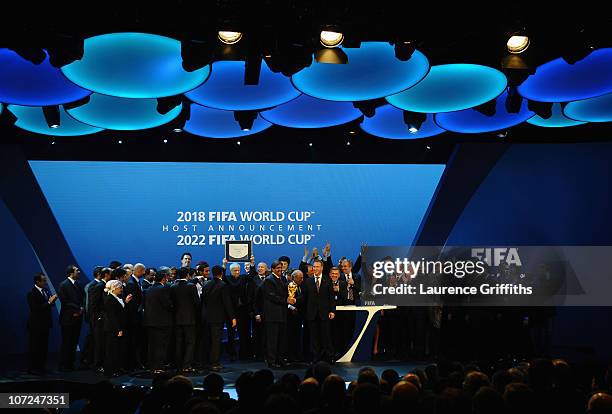 Russia and Qatar celebrate winning their bids on stage during the FIFA World Cup 2018 & 2022 Host Countries Announcement at the Messe Conference...
