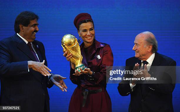 The Emir State of Qatar HH Sheikh Hamad bin Khalifa Al-Thani and Sheikha Mozah bint Nasser Al Missned are presented with the World Cup Tophy by FIFA...