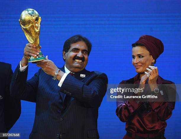 The Emir State of Qatar HH Sheikh Hamad bin Khalifa Al-Thani and Sheikha Mozah bint Nasser Al Missned are presented with the World Cup Tophy after...