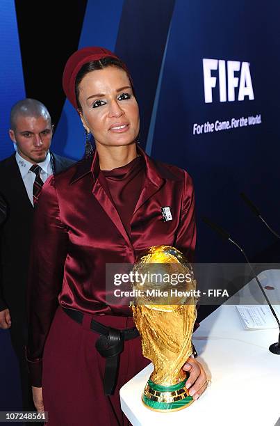 Sheika Moza bint Nasser poses with the World Cup trophy after Qatar were awarded the 2022 FIFA World Cup on December 2, 2010 in Zurich, Switzerland.