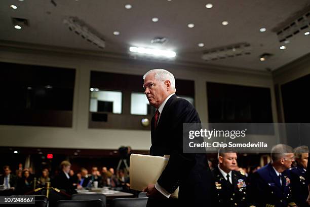 Defense Secretary Robert Gates leaves a hearing after testifying before the Senate Armed Services Committee about the military's "don't ask, don't...