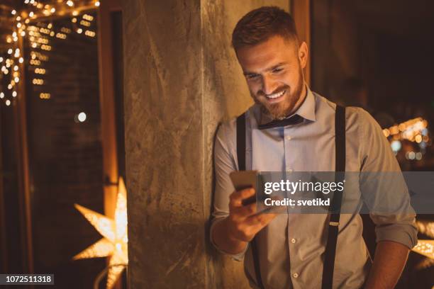 alone for new year - men of the year party inside stock pictures, royalty-free photos & images