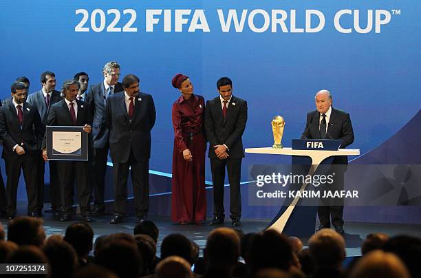 Qatar's Emir Sheikh Hamad bin Khalifa al-Thani , his wife Sheikha Moza and their son Sheikh Mohammed bin Hamad al-Thani, chairman of the Qatar 2022...