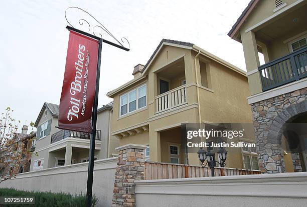 Sign hangs in front of a newly constructed Toll Brothers housing development on December 2, 2010 in Dublin, California. Toll Brothers reported fourth...