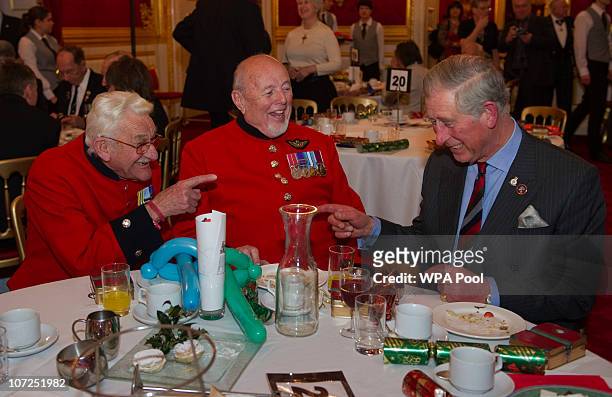 Prince Charles, Princess of Wales, speaks with Chelsea Pensioners Arthur Teesdale and Wayne Campbell during a reception for the 'Not Forgotten...