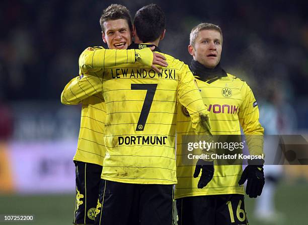 Robert Lewandowski of Dortmund celebrates the third goal with Lukasz Piszczek of Dortmund and Jakub Blaszczykowski of Dortmund during the UEFA Europa...