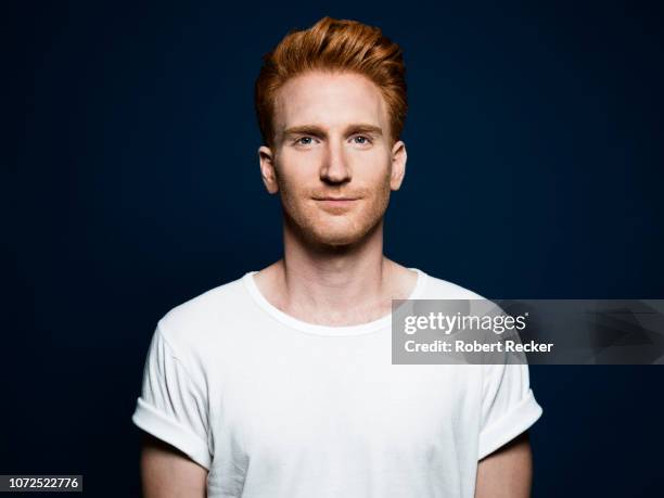 studio shot of a redhaired young man - guy in white shirt stock pictures, royalty-free photos & images