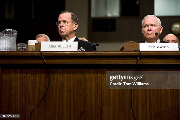 Adm. Michael Mullen, left, Chairman of Joint Chiefs of Staff, and Robert Gates, Secretary of Defense, wait to testify before a hearing of the Senate...