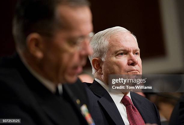 Secretary of Defense Robert Gates, right, listens to Adm. Michael Mullen, Chairman of Joint Chiefs of Staff, testify before a hearing of the Senate...