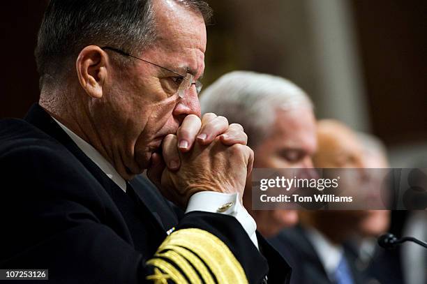 Adm. Michael Mullen, left, Chairman of Joint Chiefs of Staff, listens to Robert Gates, Secretary of Defense, second from left, testify before a...