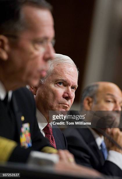Secretary of Defense Robert Gates, right, listens to Adm. Michael Mullen, Chairman of Joint Chiefs of Staff, testify before a hearing of the Senate...