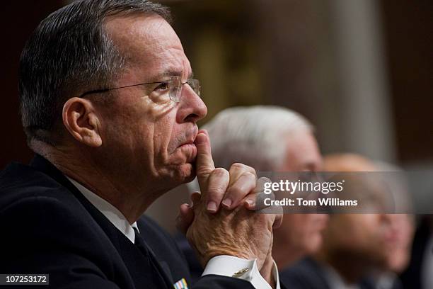 Adm. Michael Mullen, left, Chairman of Joint Chiefs of Staff, listens to Robert Gates, Secretary of Defense, second from left, testify before a...