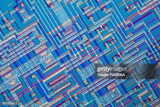 microchip, light micrograph - computer chip stock illustrations