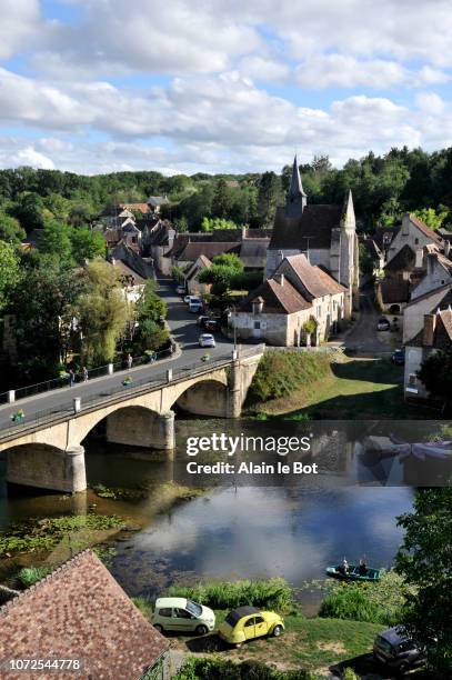 france, region of poitou charente, vienne department, angles-sur-l'anglin city, lower town with sainte-croix church and bridge over the anglin, most beautiful villages of france. - le sommer stock pictures, royalty-free photos & images