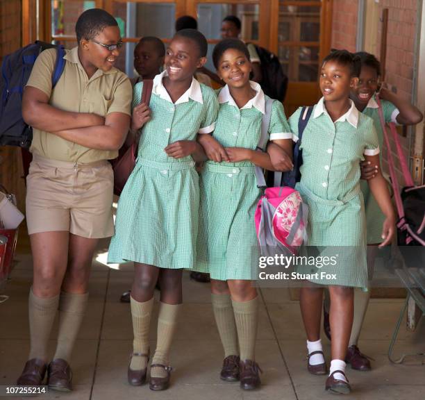 group of schoolchildren walk together, kwazulu natal province, south africa - schoolgirl stock pictures, royalty-free photos & images