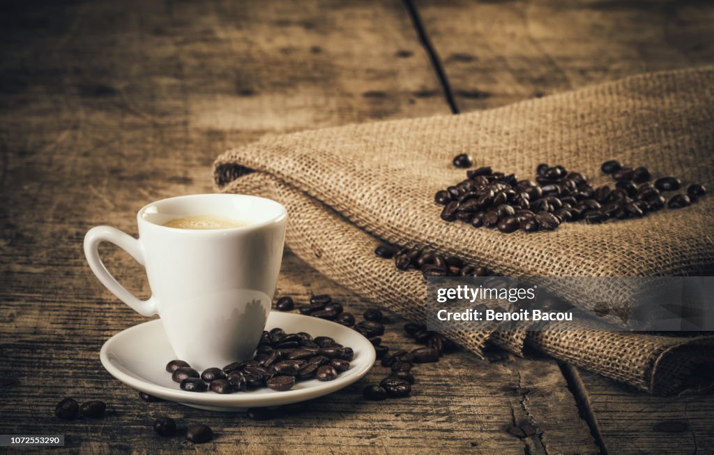 Espresso coffee on an old wooden table