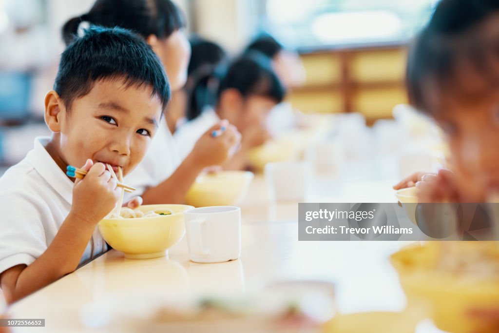 Young children eating their school lunch at preschool