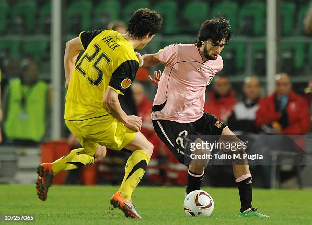 Javier Pastore of Palermo holds off thew challenge from Kamil Vacek of Sparta Prague during the Uefa Europa League Group F match between Palermo and...