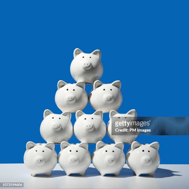 piggy bank pyramid - prosperity stock pictures, royalty-free photos & images