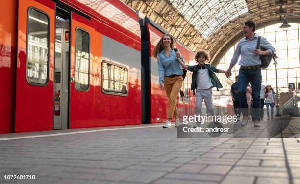 happy family traveling by train - moscow railway station stock pictures, royalty-free photos & images
