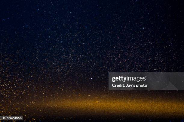 hot and cold defocused lights - glitter black background stock pictures, royalty-free photos & images