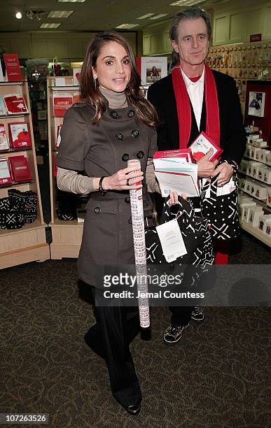 Her Majesty Queen Rania Al Abdullah of Jordan and RED Co-Founder Bobby Shriver make an appearence at the LeMarc's Hallmark Gold Crown Store on...
